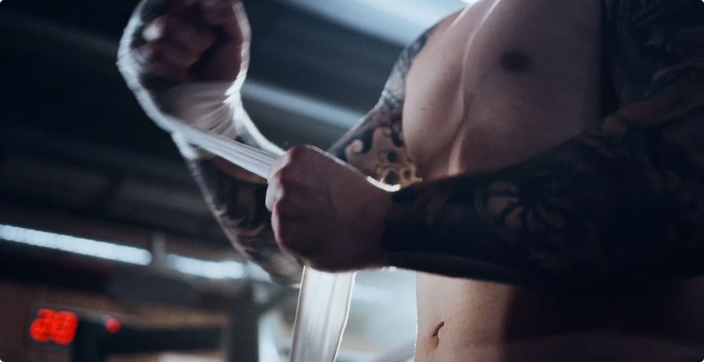 A climber on a mountain ridge at sunrise